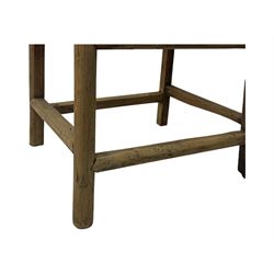 Late 19th century Chinese Qing dynasty high chair, rectangular back with central splat carved with stylised bat motif, applied brasswork to the arms and seat, on rounded supports with double stretcher