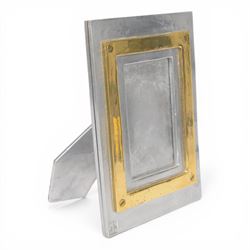 David Marshall photo frame, of cast aluminium mounted with a smaller brass frame, the make...
