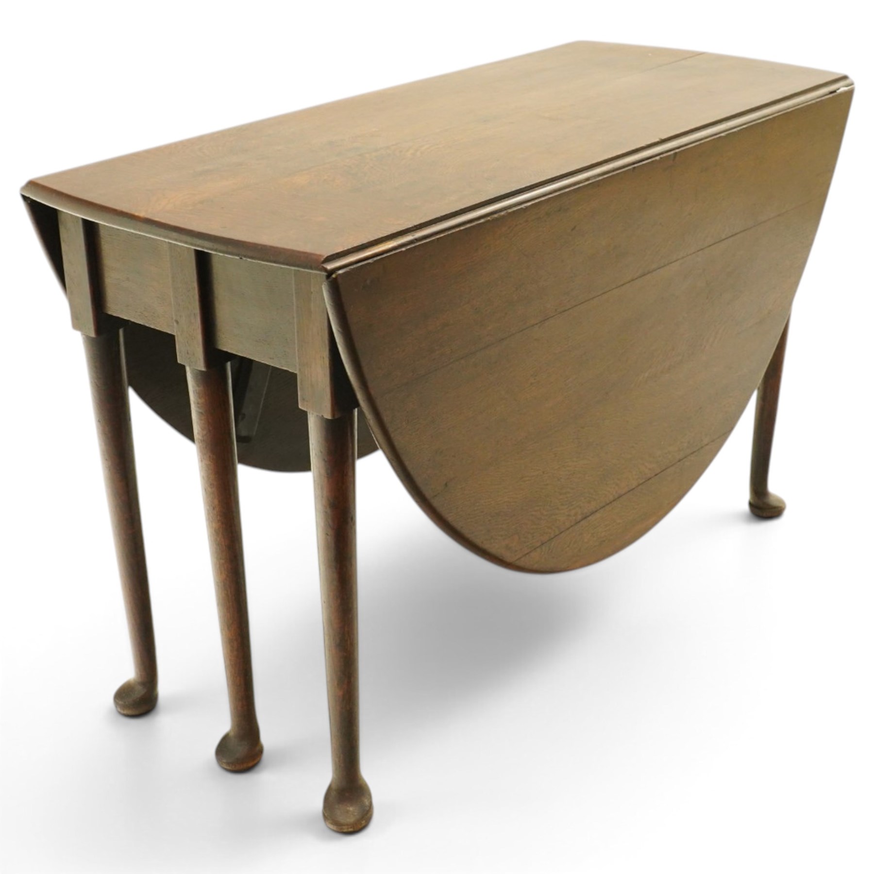 George III oak six-legged drop-leaf dining table, the oval drop-leaf top over six gate-leg supports with pad feet