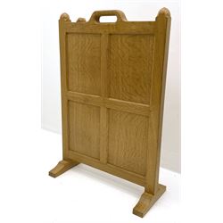 ‘Mouseman’ oak four panel firescreen, the cresting rail with handle and mouse signature, on sledge supports, by Robert Thompson of Kilburn 