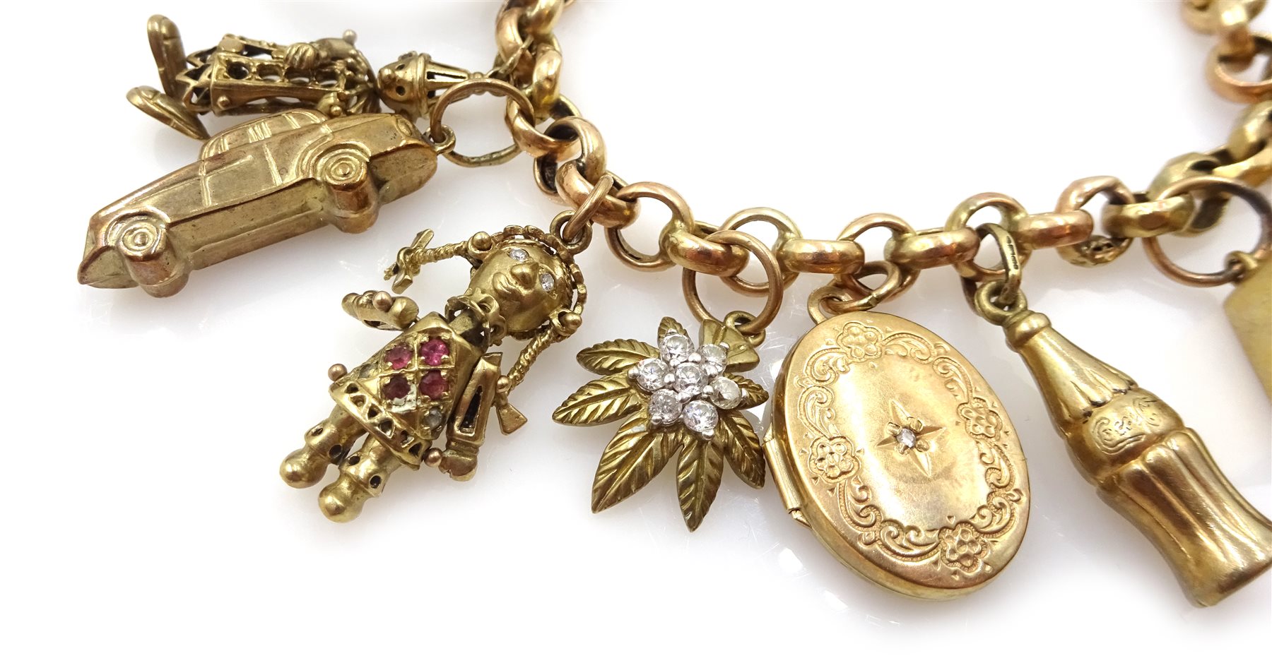 Gold belcher link bracelet with fourteen gold charms including ragdoll, clown, horse and money box, all 9ct hallmarked, tested or stamped