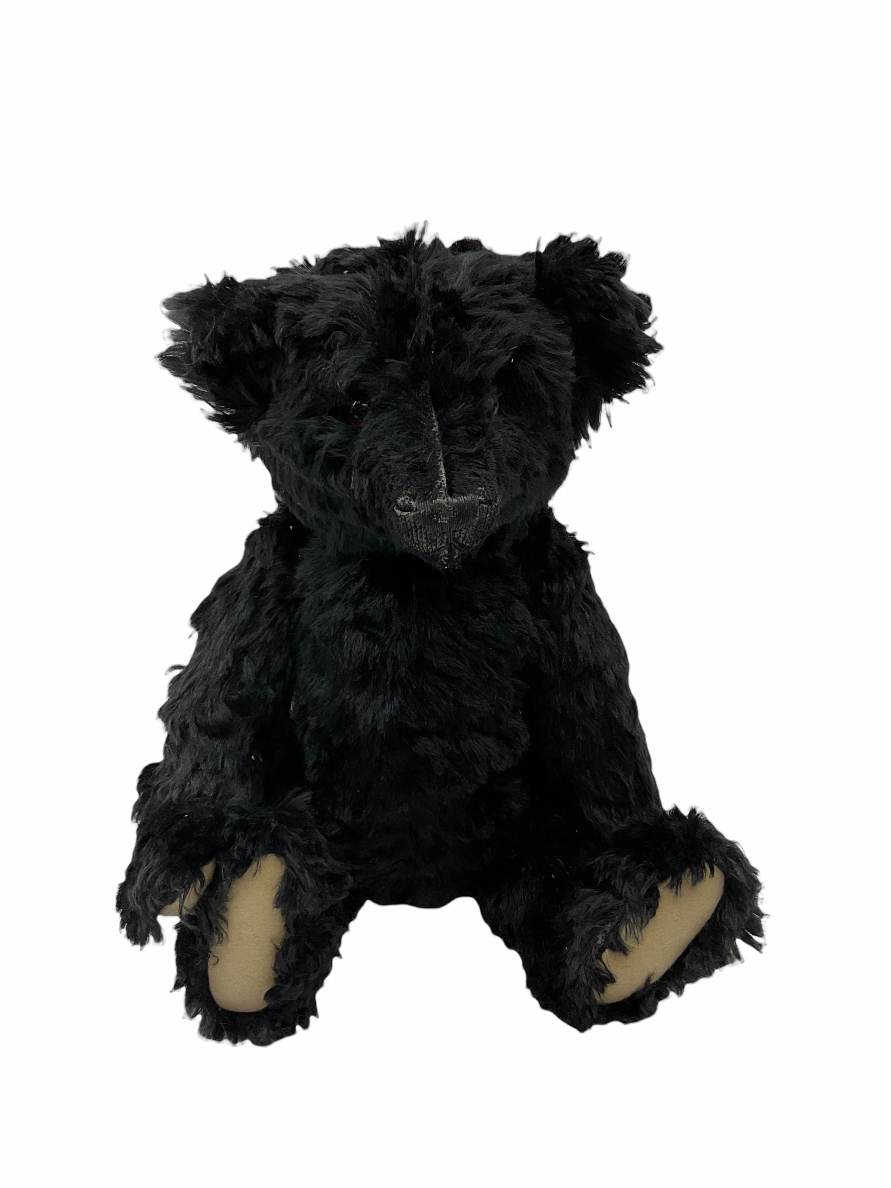 1991 Atlantic Bears limited edition black teddy bear, the revolving head with applied eyes, vertically stitched nose and jointed limbs with growler mechanism No.84/100 H53cm; together with clockwork tin-plate road roller possibly by Mettoy and a push-along painted scratch built wooden locomotive (3)