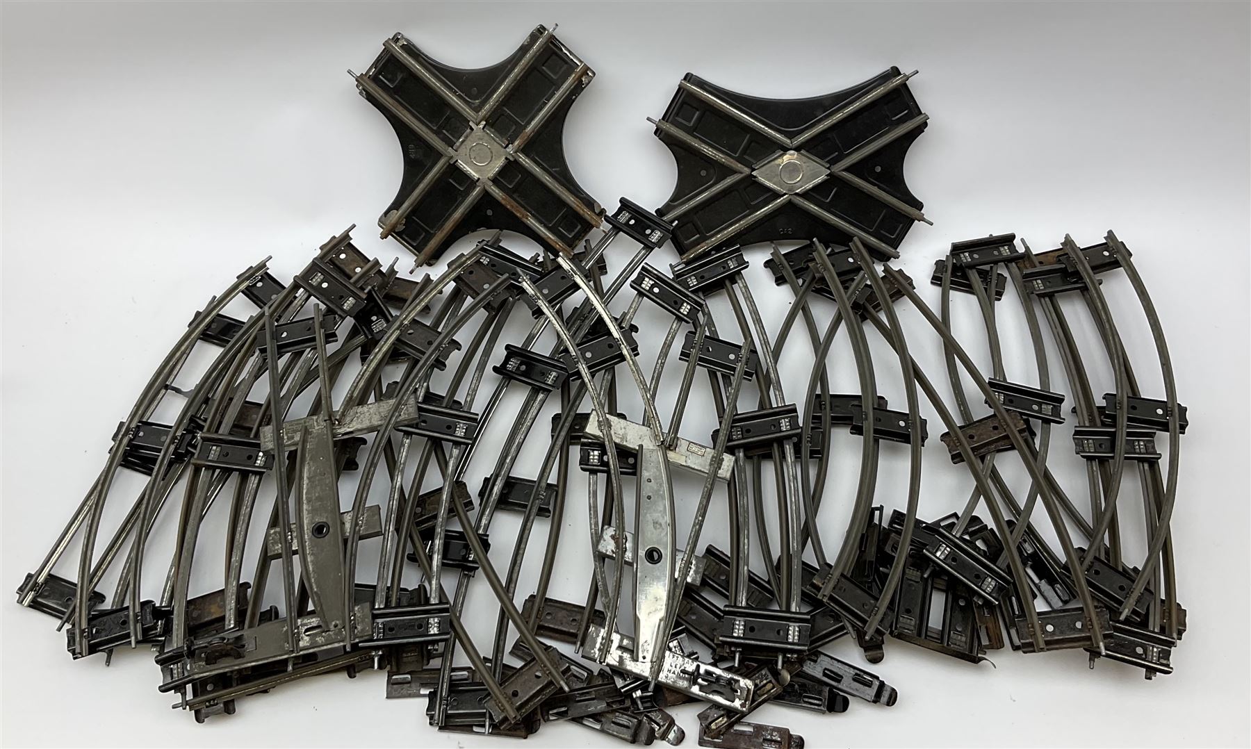 Hornby '0' gauge - layout accessories comprising PR1/PL1 Points, CR1 Right Angle Crossing and CA2 Acute Angle Crossing, all boxed; tin-plate signal box; tin-plate level crossing; textured wooden tunnel, possibly pre-WW2; and quantity of track, some boxed; together with '00' gauge tin-plate station