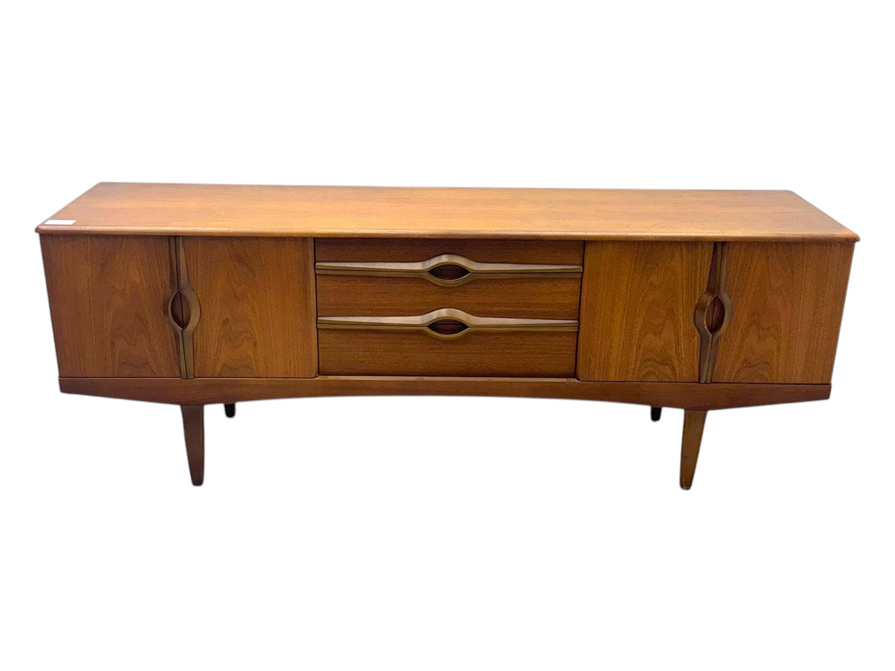 Stonehill - mid-20th century teak sideboard, three central drawers flanked by concertina cupboard doors, on tapering supports