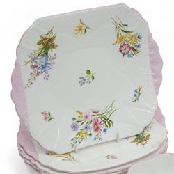 Shelley 'Wild Flowers' pattern part tea service, comprising four coffee cups, five coffee cup saucers, nine teacups, eight teacup saucers, coffee pot, three milk and cream jugs, two bowls, five cake plates etc