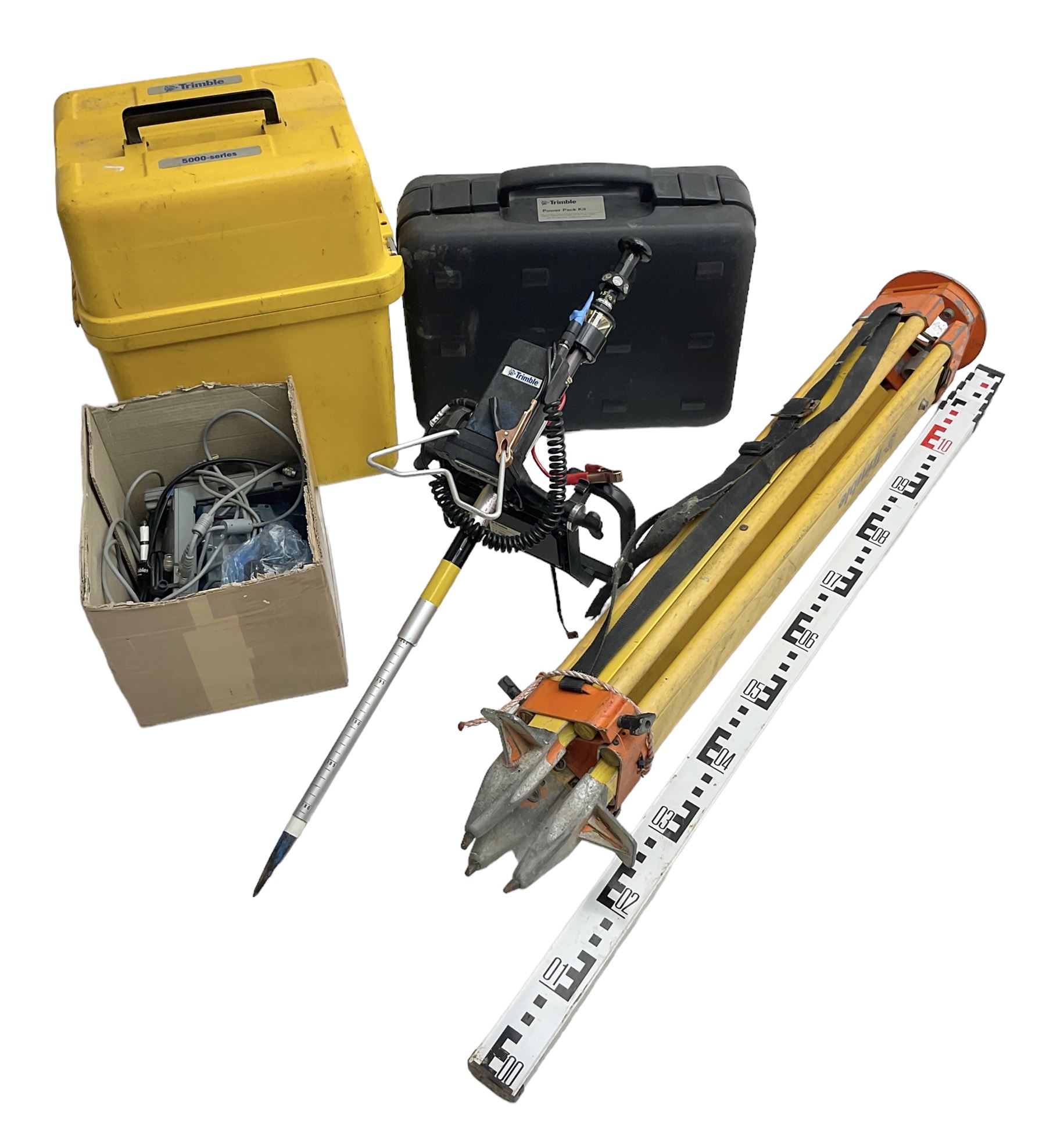 Trimble land surveying equipment - 5000 Series 5603 DR300+ Robotic Reflectorless Total Station, serial no.84310406; in carrying case; together with GPS Holder 58317019, serial no.95320184; ACU 571225500, serial no.83214786; Docking Station 58252019, serial no.95823458 with Power Supply; RMT 606 Remote Target on pole with CU Holder and External Georadio 2.4GHz; cased Power Pack Kit; folding tripod; and aluminium 5m telescopic measuring staff