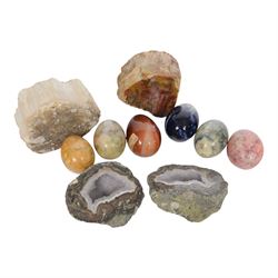 Collection of polished egg shaped mineral specimens, together with amethyst geodes and other minerals  