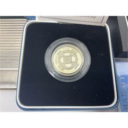 The Royal Mint United Kingdom 'Millennium' silver proof two coin set comprising 1999 and 2000 five pound coins, 2000 'The Queen Mother Centenary Year' silver proof crown, 2001silver proof one pound, 'Her Majesty The Queen Golden Jubilee 1952-2002' silver proof 2002 five pound coin and ten pound banknote set, all being cased with certificates, United Kingdom 1999 brilliant uncirculated coin collection in card folder, other commemorative coinage etc