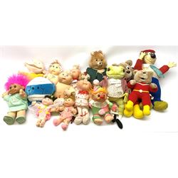 Fifteen character soft toys and dolls including Teddy Ruxpin talking bear with inbuilt battery operated cassette player, six Cabbage Patch dolls, two Trolls, Jeremy Fisher, two Superteds, Semco Yogi Bear etc