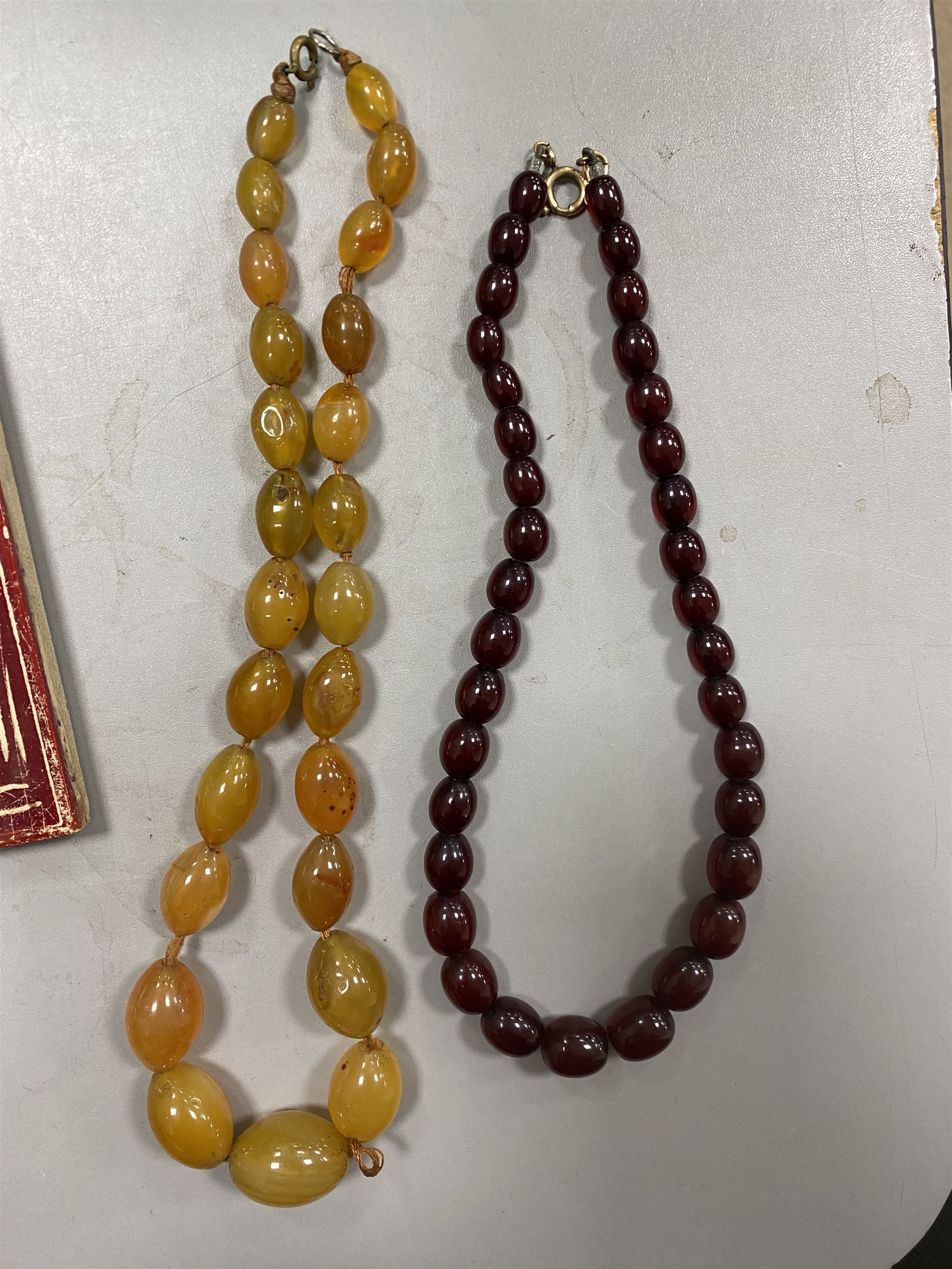 9ct gold St Christopher charm, together with a collection of costume jewellery including beaded necklaces, gold plated flat link bracelet and two wristwatches