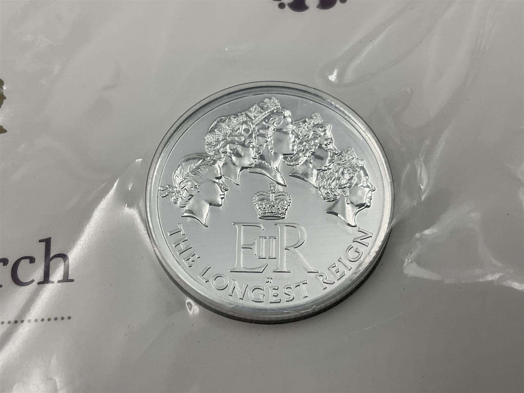 Three The Royal Mint United Kingdom fine silver twenty pound coins, comprising 2014 'Outbreak', 2015 'The Longest Reigning Monarch', 2016 'The 90th Birthday of Her Majesty the Queen', all on cards
