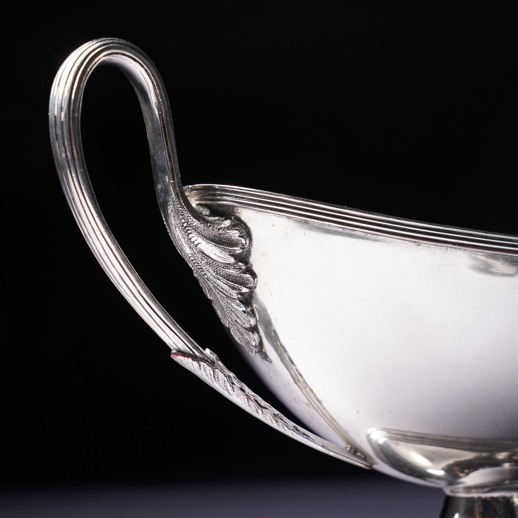 Pair of silver plated sauce tureens and covers of oval form with reeded loop handles L25cm overall