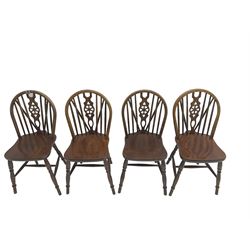 Set four oak wheel-back dining chairs, hoop and stick back with central pierced wheel, raised on turned supports united by H-stretcher