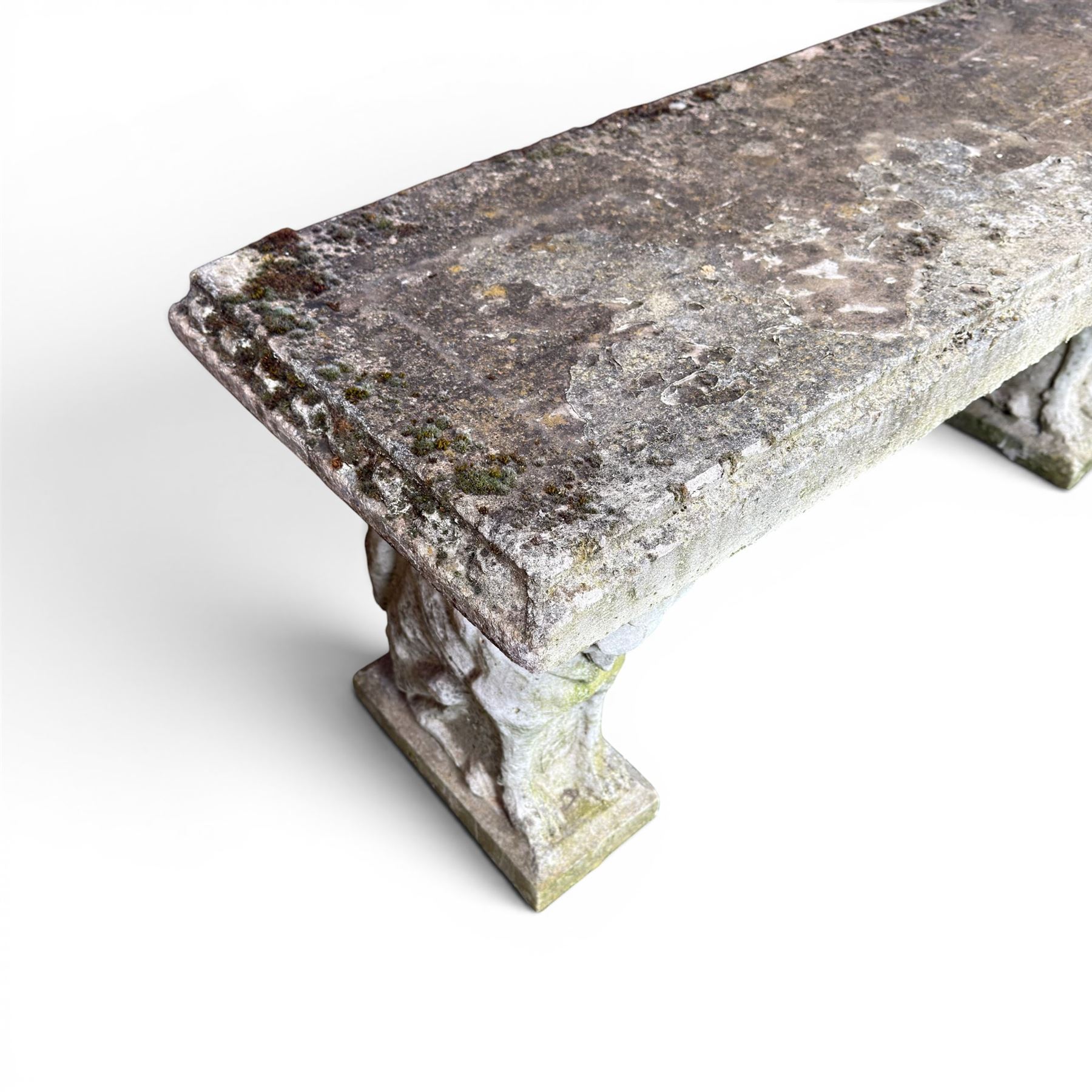 Weathered cast stone three piece garden bench, slab top raised on mythical creature supports