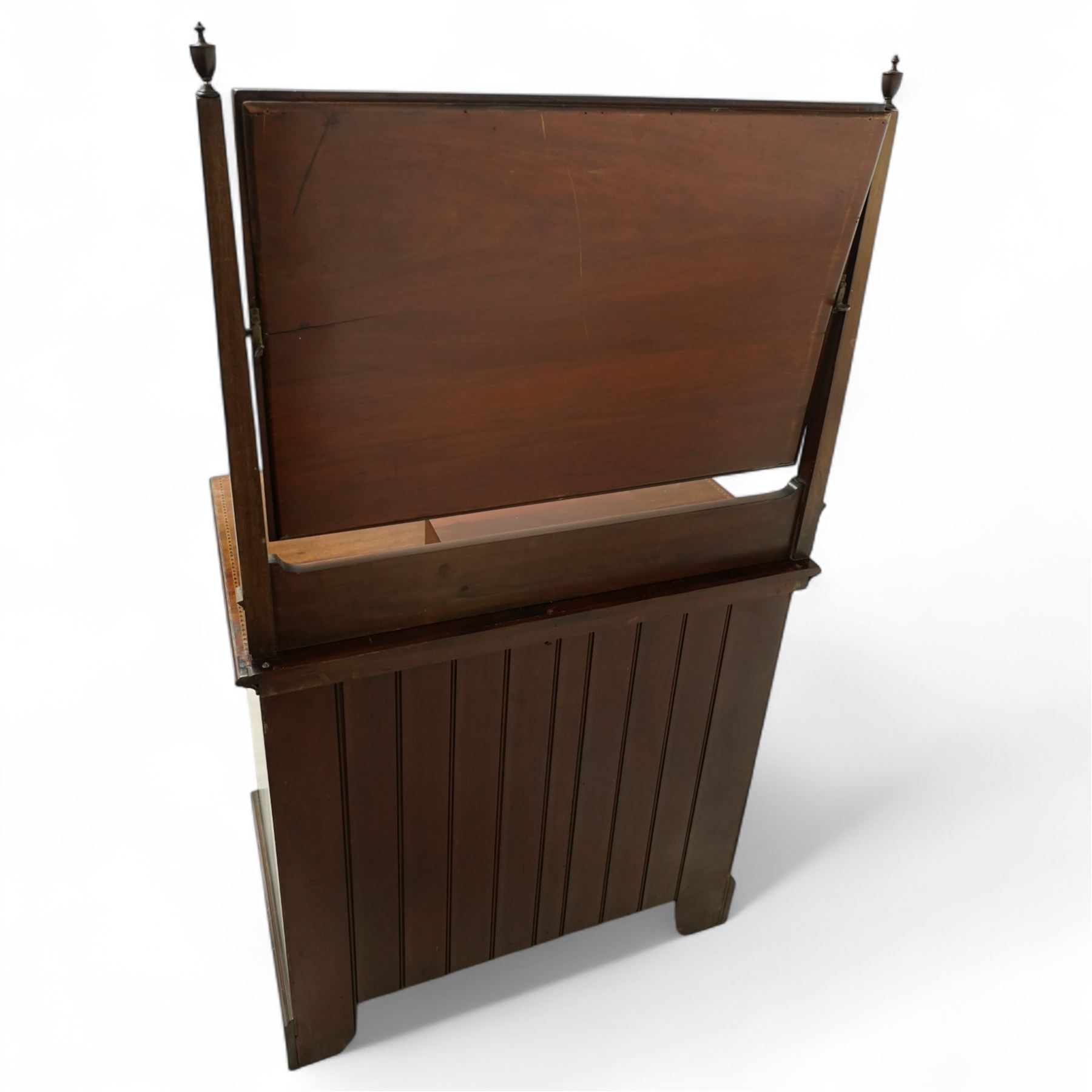 Edwardian mahogany herring-bone inlaid dressing chest, with swivel bevelled dressing mirror, supports with finials, and trinket drawer above chest with three graduated drawers on bracket feet