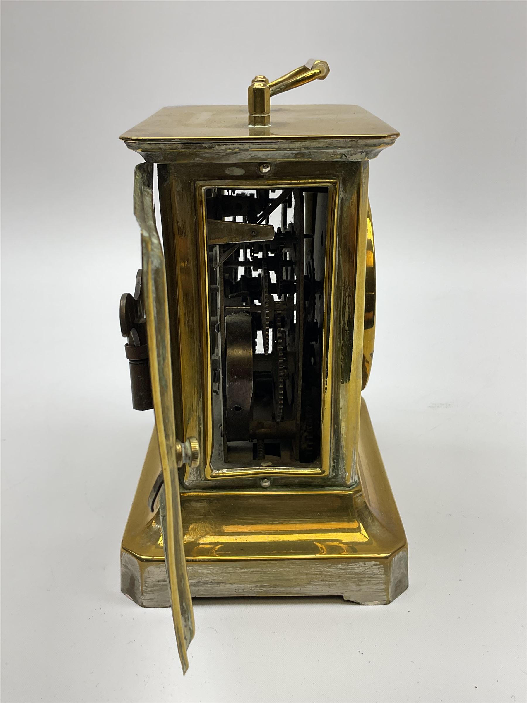 Late 19th century German Junghans “Joker “carriage clock with a musical alarm, engraved rectangular dial plate, circular card dial within an integral glazed bezel, roman numerals, minute track and alarm dial, steel spade hands, glass side panels (one missing) and rear case door, thirty-hour spring driven movement, pin pallet balance escapement, rear wound and set. 
With key.
