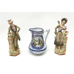 A 19th century Commemorative jug for the marriage of the Prince of Wales - later Edward VII to Alexandra 1863, with printed and lustre decoration, H19cm, together with a pair of bisque figures modelled as male and female figures. (3). 