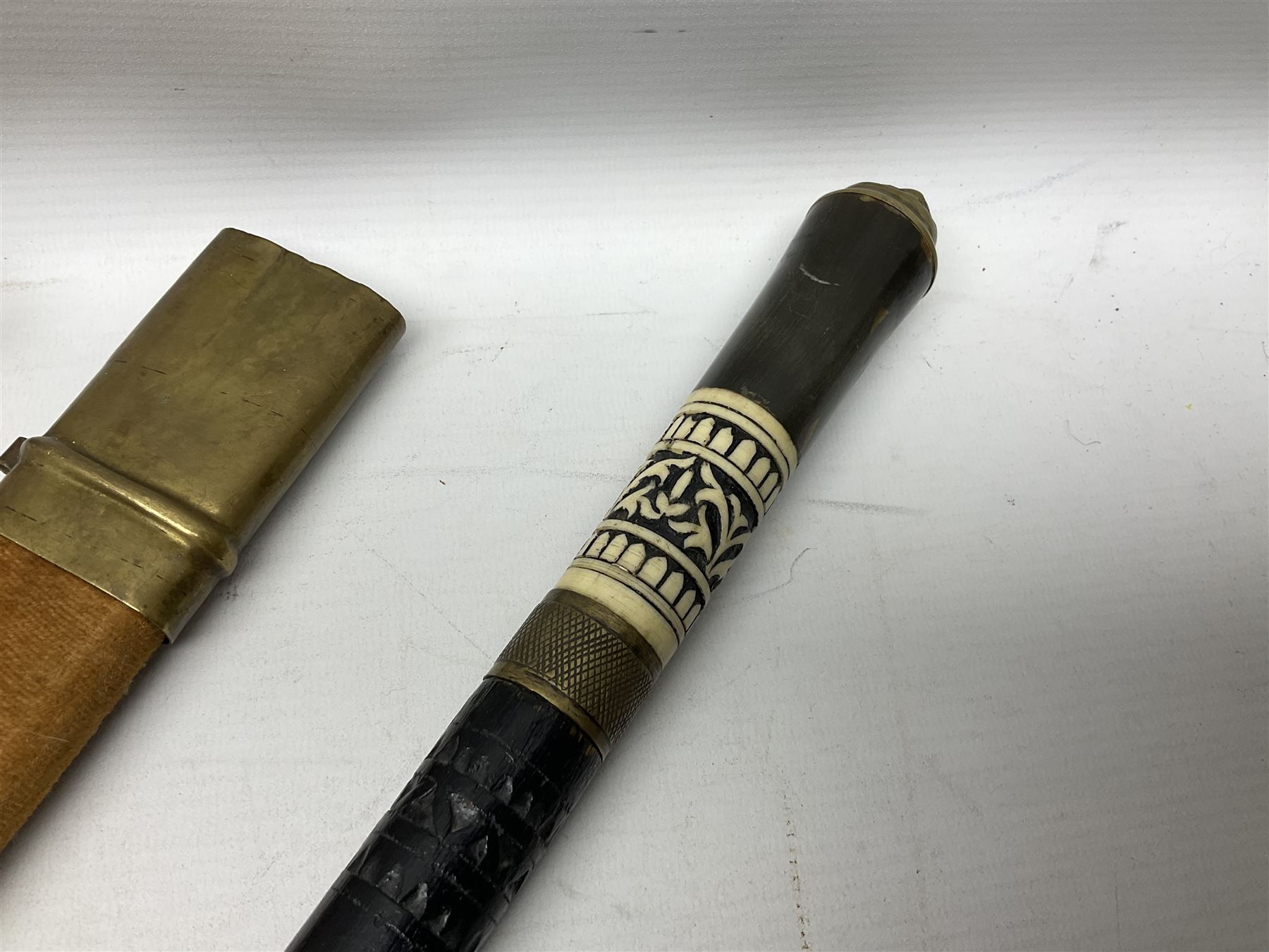Early 20th century Indian ebonised sword stick, the 59.5cm blade with punched decoration and horn grip L94cm overall; and a reproduction Indian tulwar with scabbard (2)