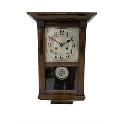 Early 20th century striking wall clock with a silvered sheet dial.