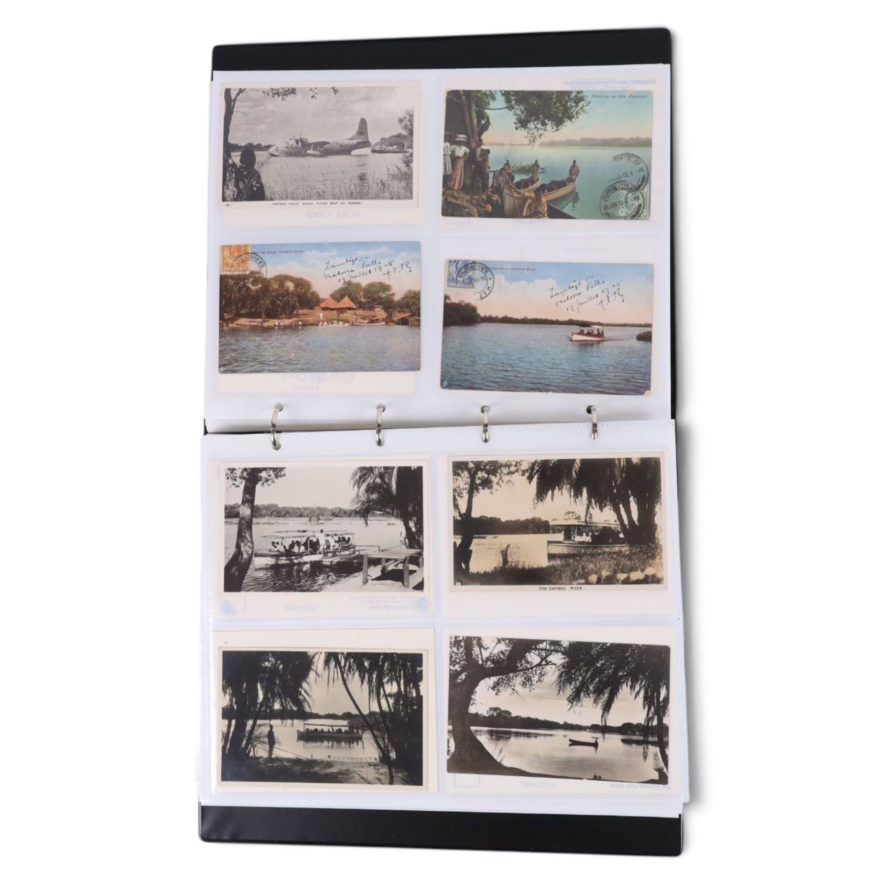 Collection of mid 20th century and later African postcards, including railways, Victoria Falls, Tribes, village scenes, etc, some blank and some with written messages, housed in two albums