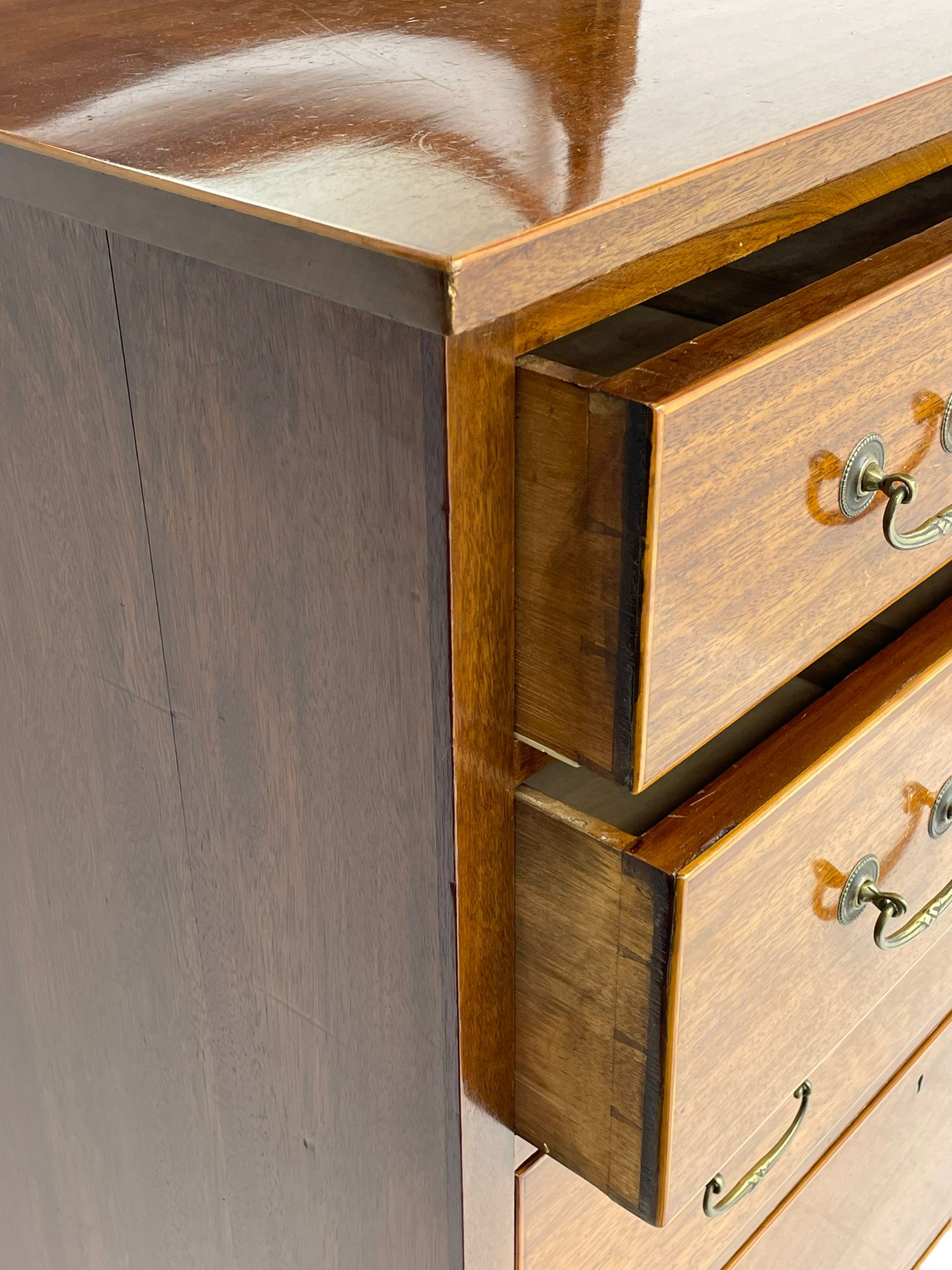 George III design mahogany straight-front chest, raised oval swing mirror with bevelled glass on turned supports, fitted with five graduating drawers with boxwood stringing, on bracket feet