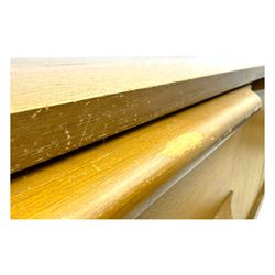 Mid-20th century teak sideboard, fitted with a fall-front cupboard, three drawers including a green baize-lined cutlery drawer, and a double cupboard, with integrated handles, on sleigh supports