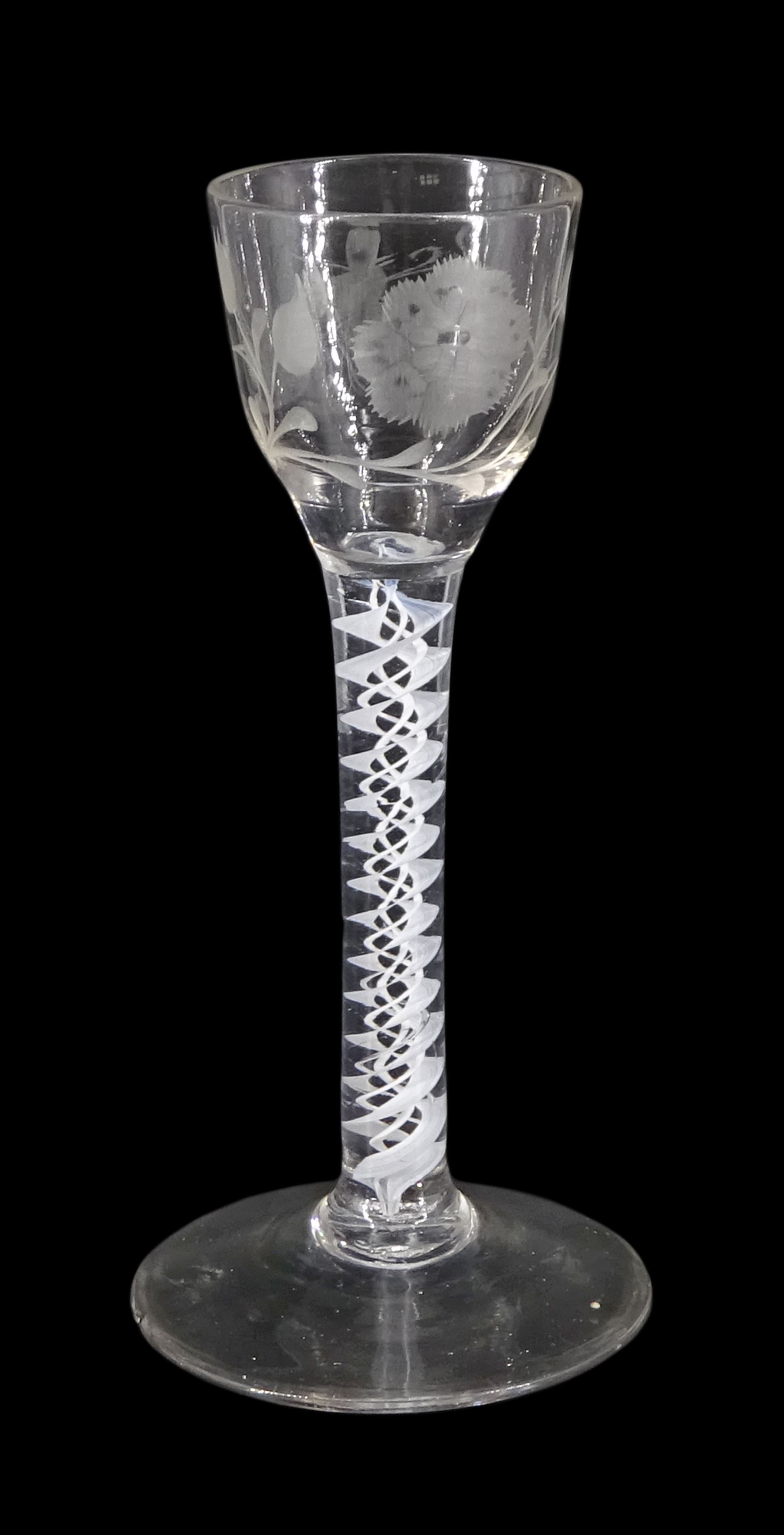 18th century drinking glass of possible Jacobite interest, the ogee bowl engraved with carnation and bee, upon a double series opaque twist stem and conical foot, H16cm