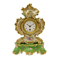  19th century porcelain clock on stand by Jacob Petit, the Rococo cartouche shaped case with gilt scrollwork and painted with foliage on a green ground, white enamel Roman dial signed Hry.Marc A Paris, brass movement stamped 11579, marked JP in blue on base, H30cm  