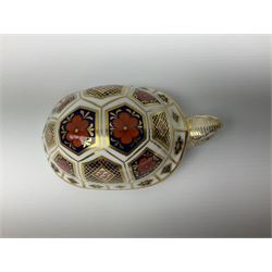Royal Crown Derby tropical fish paperweight in the form of a Guppy, with a silver stopper, and Royal Crown Derby tortoise paperweight with gold stopper