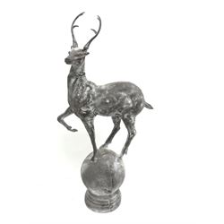Pair cast metal garden stags on spherical mounts, figures/gate post finials, 