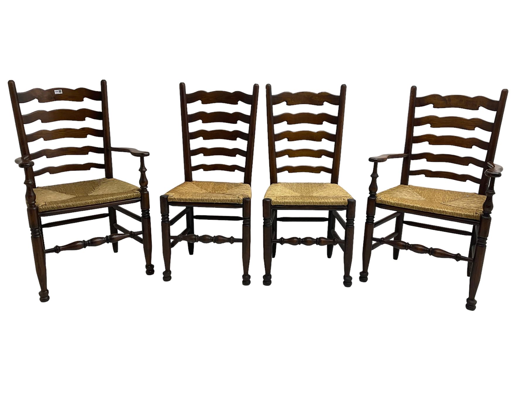 Set eight (6+2) oak dining chairs, high waived ladder back over rush seats, raised on ring turned supports with pad front feet, united by stretchers