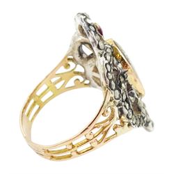 19th century gold and silver marcasite portrait ring, set with an oval miniature of a woman on ivory, under a glazed panel, with a marcasite and red stone set crossover surround, with pierced gold shoulders and reeded shank. This lot has been registered for sale under Section 10 of the APHA Ivory Act