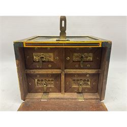 Small wooden collectors chest, painted to each side with birds upon a black ground within red and yellow borders, opening to reveal a compartmentalised interior containing one long drawer above two smaller drawers, H13cm, W18cm, D14.5cm