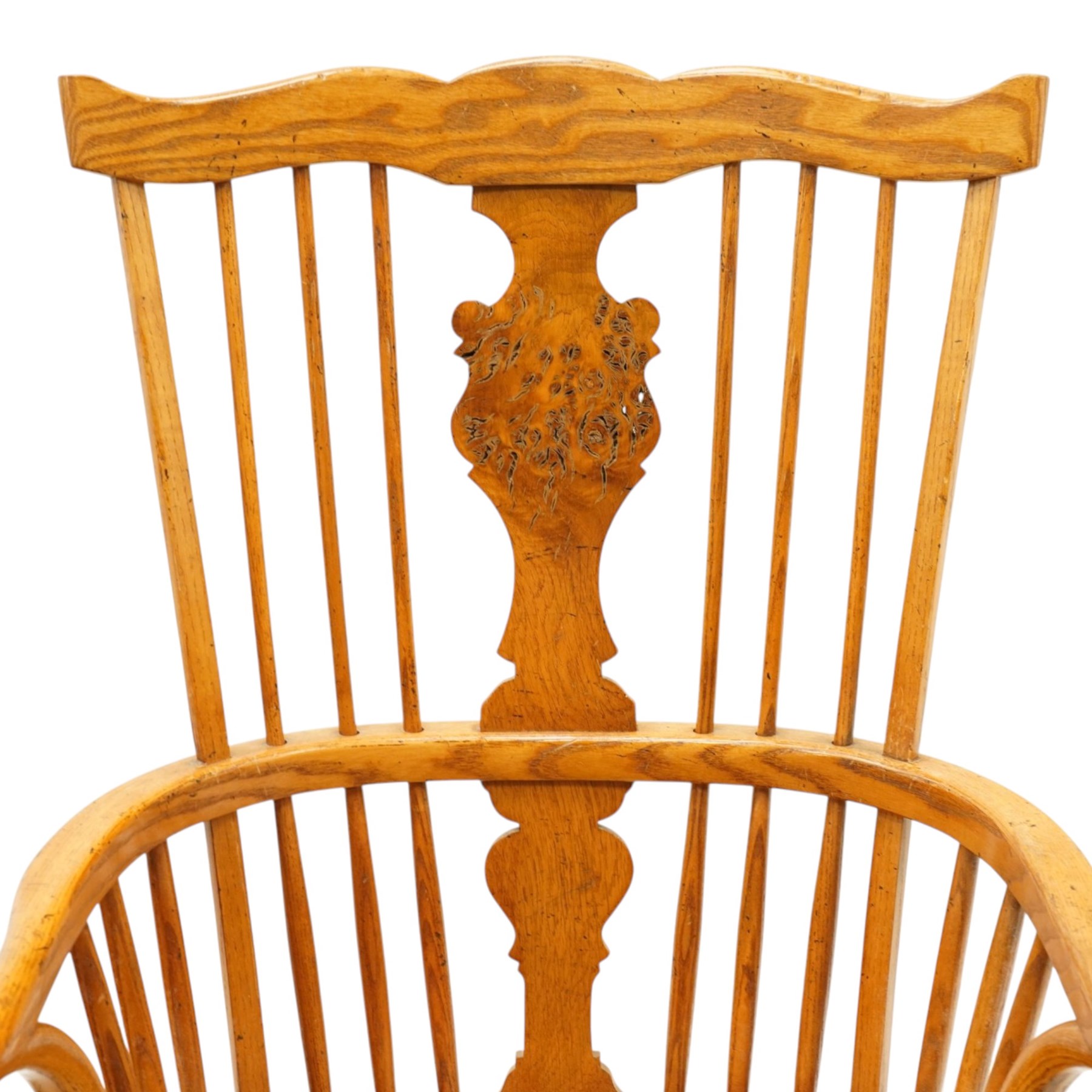 Quality set of six (4+2) golden figured and burr oak Windsor chairs, the yoke-shaped cresting rail over a vasiform shaped splat and spindle back, shaped saddle seat raised on turned supports united by crinoline stretcher