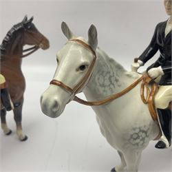 Beswick hunting group, comprising huntswoman on dappled grey horse no 1730, huntsman on bay horse no 1501, two fox figures no 1440 and 1748, and four fox hounds, all with printed marks beneath (8)
