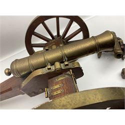 Large model brass cannon, upon wooden base, together with two similar smaller cannons, largest L48cm