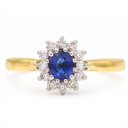 18ct gold sapphire and diamond cluster ring, single oval cut sapphire of approx 0.45 carat...