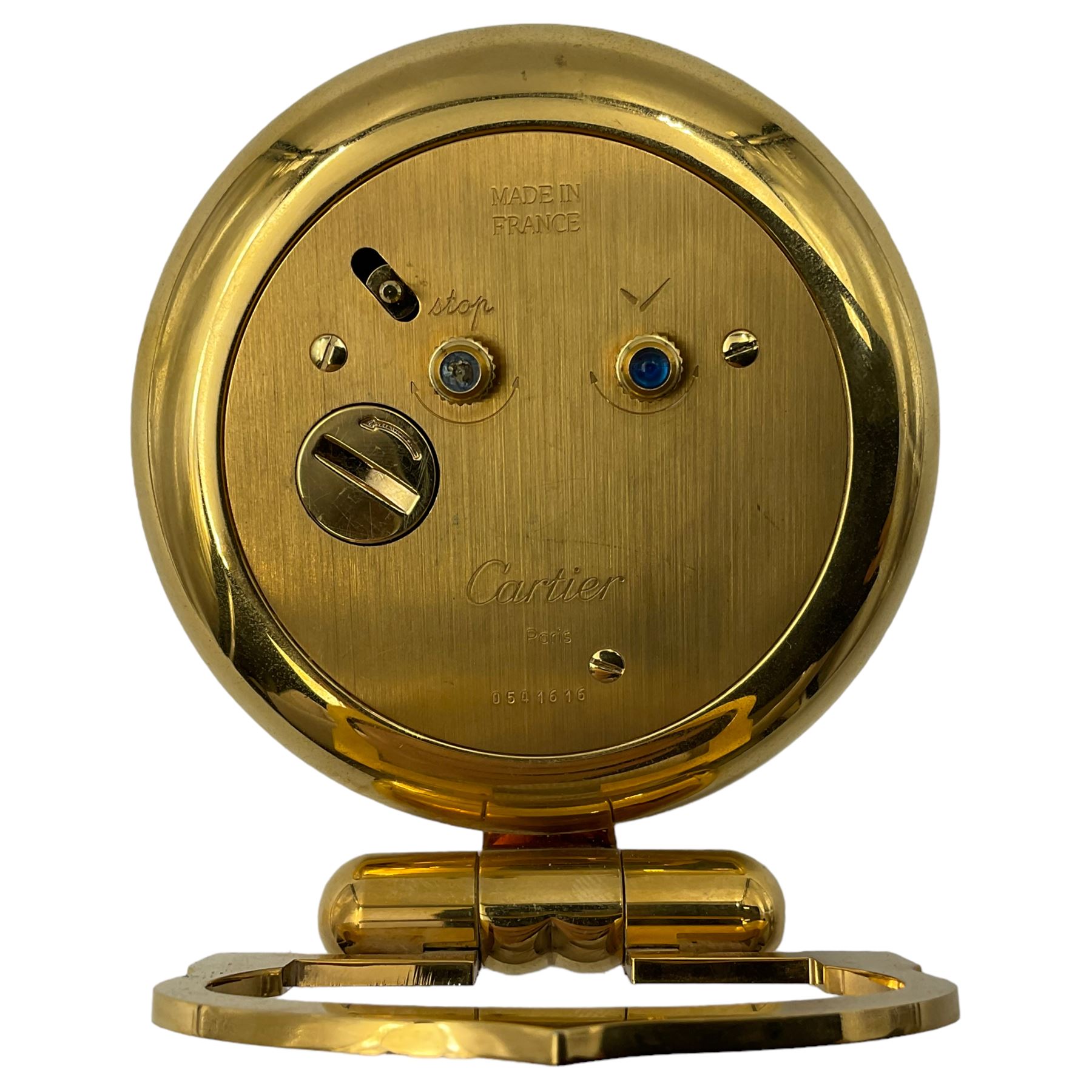 Cartier, Pasha de Cartier desk/travel clock, of circular form with gilt finish and white dial, with quartz movement, inscribed verso Made in France, Cartier Paris, serial no 0541616, dial D5cm, clock H9.7cm