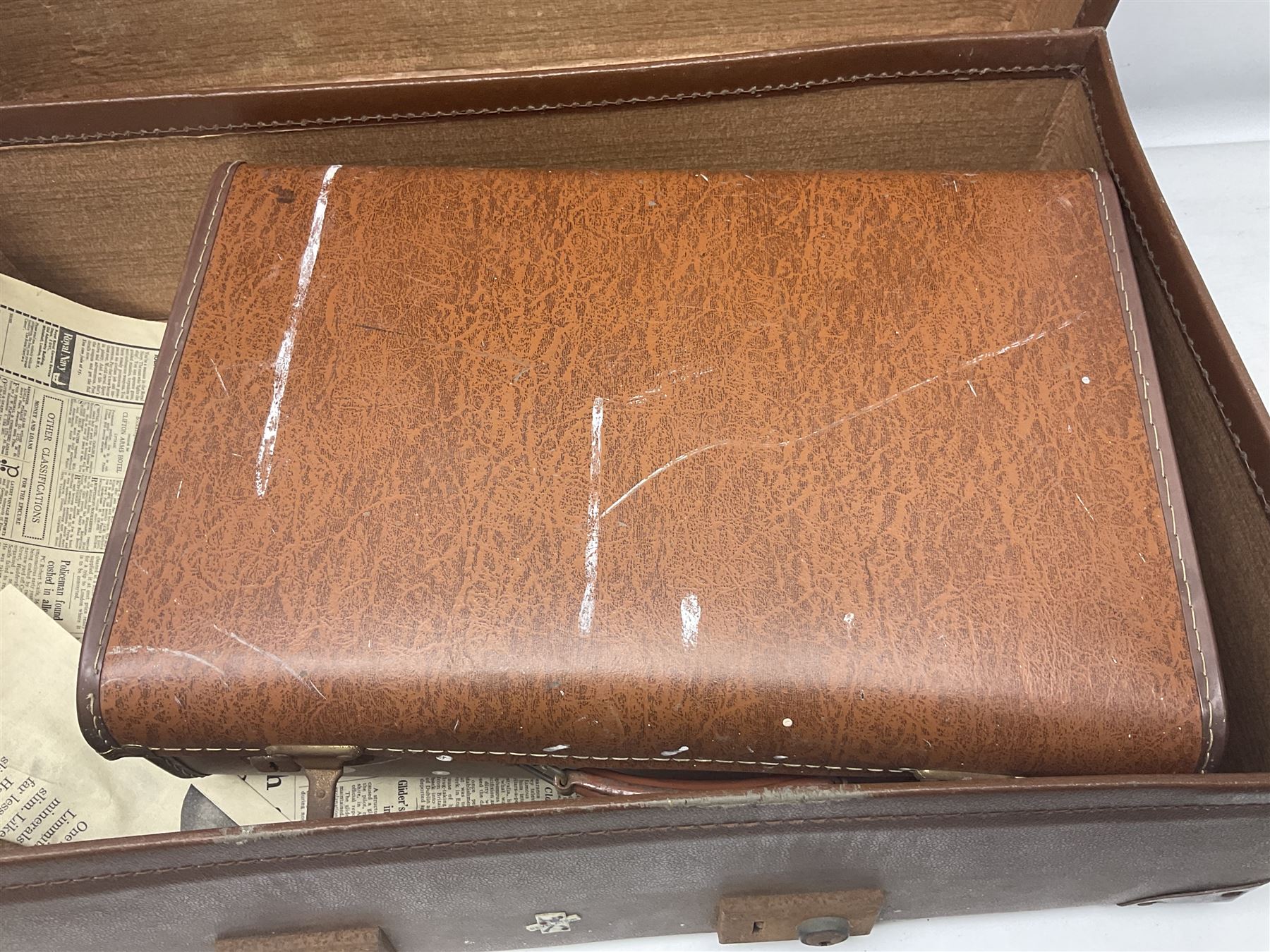 Three shooting sticks, together with four vintage leather brown suitcases of various sizes, largest suitcase H40cm L65cm 