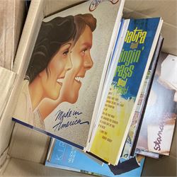Large quantity of vinyl LPs to include Madonna, ABBA, The Carpenters etc, together with a quantity of 45rpm records, to include approx nine The Beatles The Singles Collection examples etc