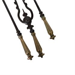 Set of three 19th century brass and steel fire irons, each with tapering and hexagonal capped handles, comprising poker, tongs and shovel with pierced detail, poker L84cm