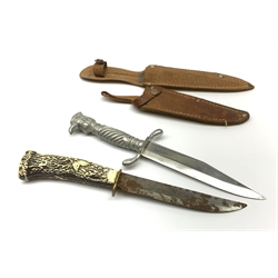 20th century hunting knife with 13cm single edge blade, cast white metal hilt with S-shaped quillon, wrythen grip and eagle head pommel L25cm overall; and another hunting knife with Solingen 12cm blade and simulated stag antler grip, both in leather sheath (2)