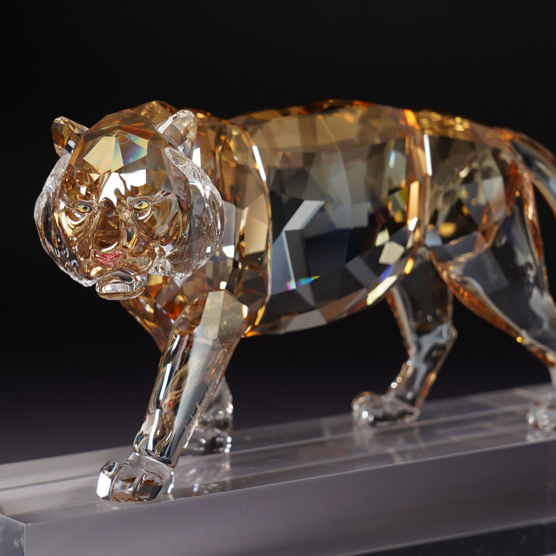 Swarovski, Endangered Wildlife, Tiger and two cubs, each with box, together with glass stands 
