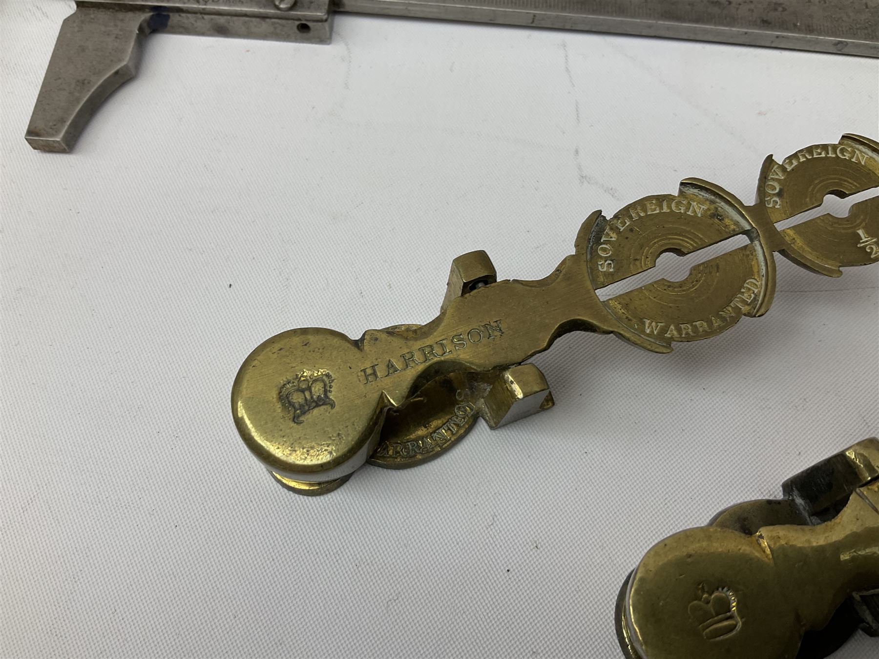 Two Victorian brass sovereign scales, one marked 'Harrison' L10cm; cased set of drawing instruments by G. Thornton Limited Manchester; Chesterman No.770/1 steel vernier caliper; two boxwood rulers; cased slide rule; brass and boxwood rope/wire gauge etc