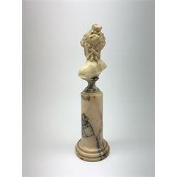 Louis Sosson (fl. 1905 - 1930), French carved ivory bust, modelled as Ariadne wife of Bacchus, or a Bacchante, signed verso L. Sosson, raised upon a marble column with socle top and stepped base, H27cm
