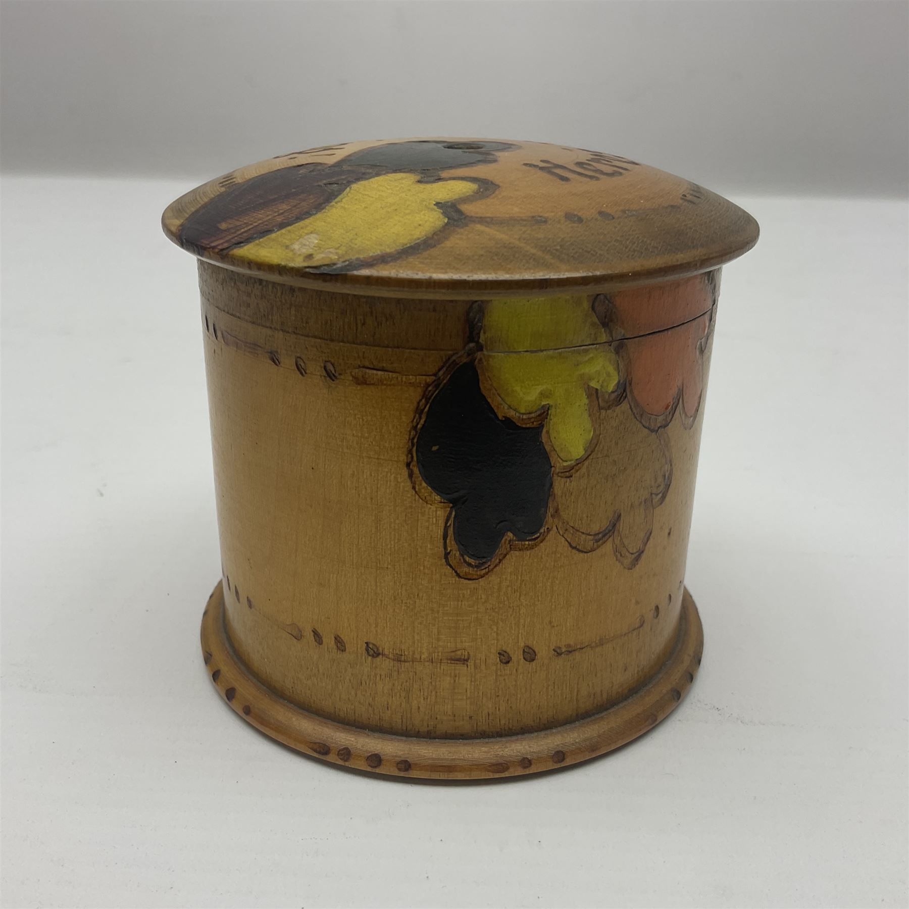 1930s pokerwork string dispenser, with tricoloured abstract decoration and 'Here's the String' to cover, H8cm