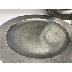 Group of seven 19th century pewter chargers, each of circular form with dished centre, two examples with touch marks verso, each approximately D39cm