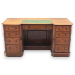 Victorian mahogany reverse breakfront desk, with inset green leather writing surface, abov...