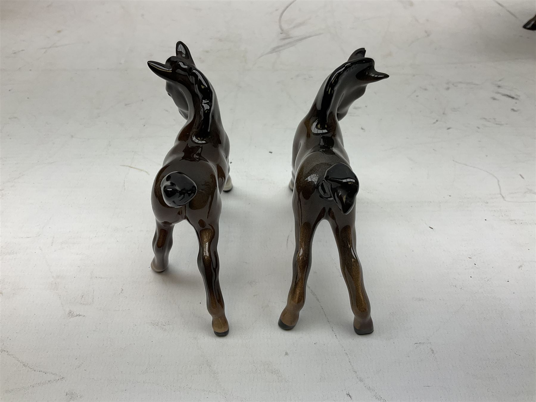 Six Beswick figures of bay horses, including large hunter no.1734, Shire horse no.818, horse with tucked head no.1549, etc (6)