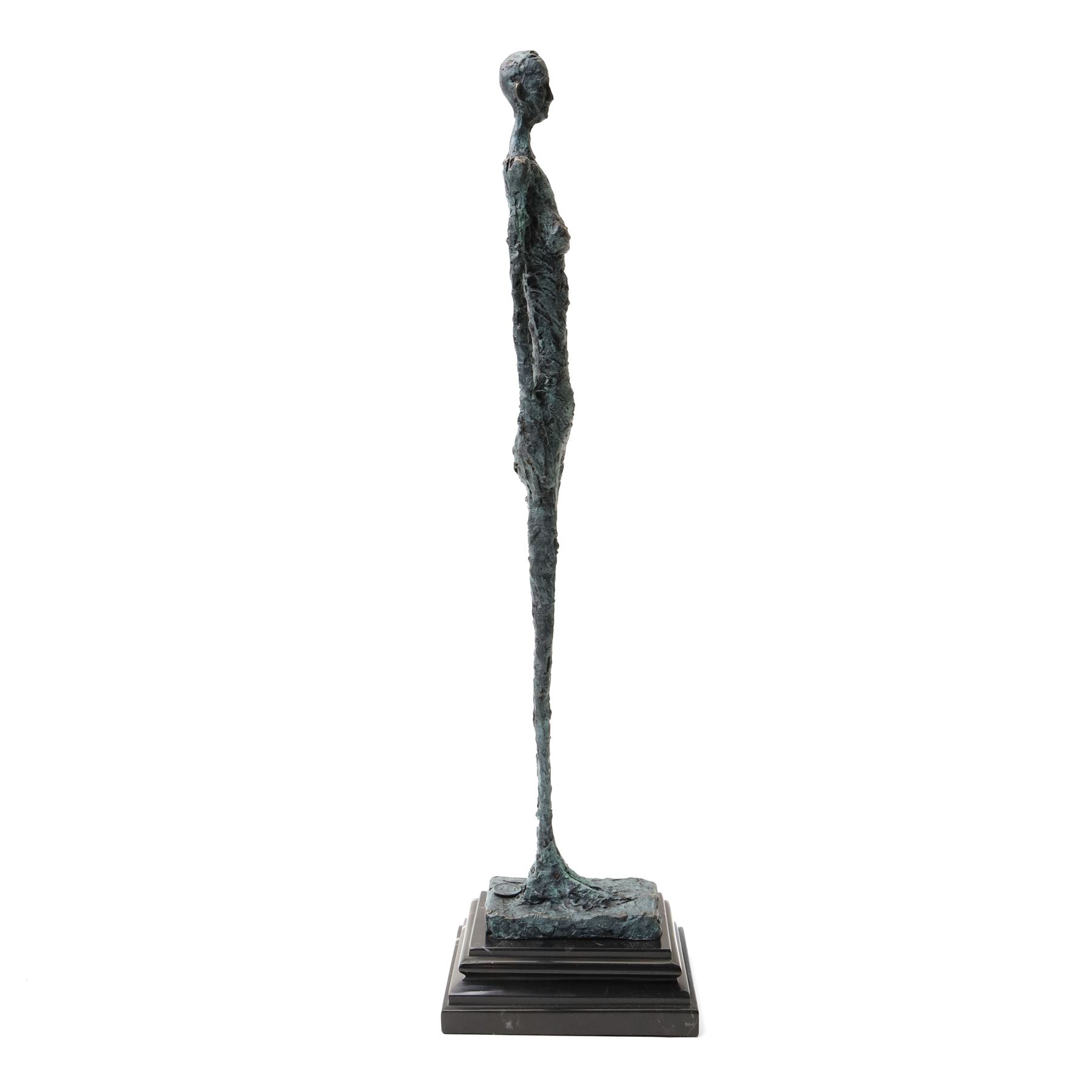 After Alberto Giacometti (Swiss 1901-1966): Femme Venise bronze upon a stepped marble base, overall H49cm
